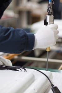 A Close Up of an Employee's Hands Manufacturing New Products