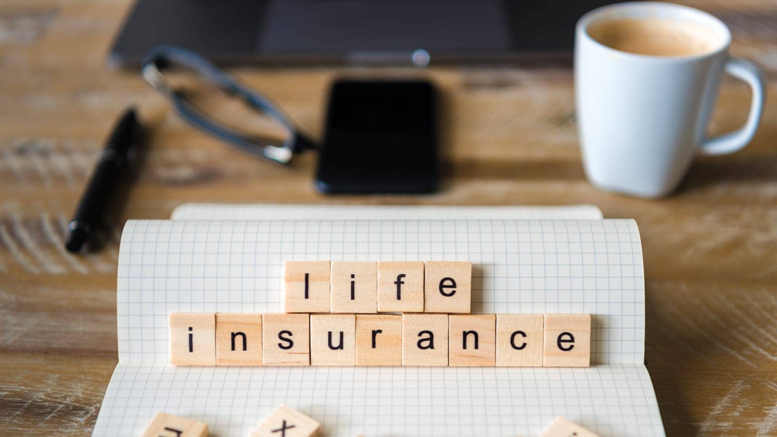 Scrabble tiles spelling out life insurance