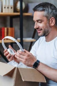 Man unboxing a new pair of headphones.