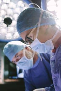 Surgeons during medical procedure.