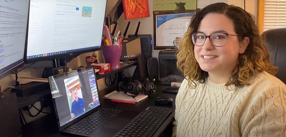 Smiling Woman Sitting at Desk