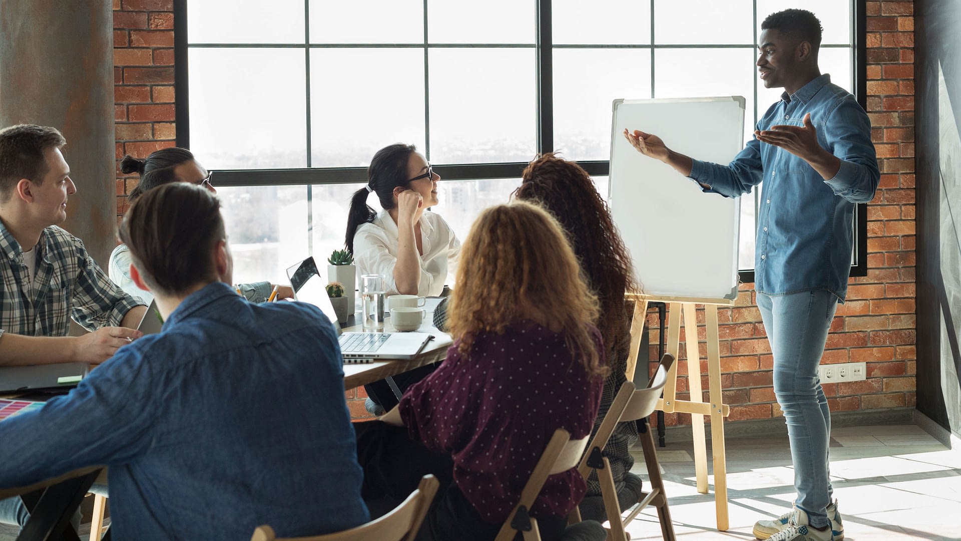 Group benefits professional presenting to a small team.