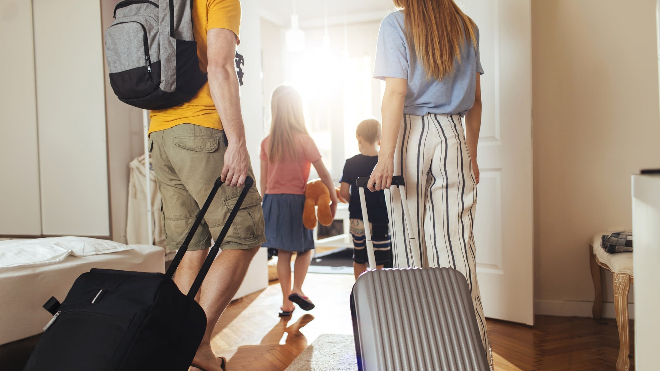 family leaving the house for vacation family with suitcases