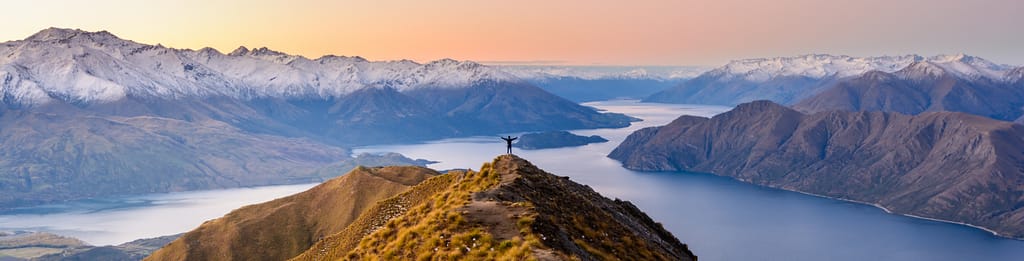 Person standing on mountain in New Zealand.