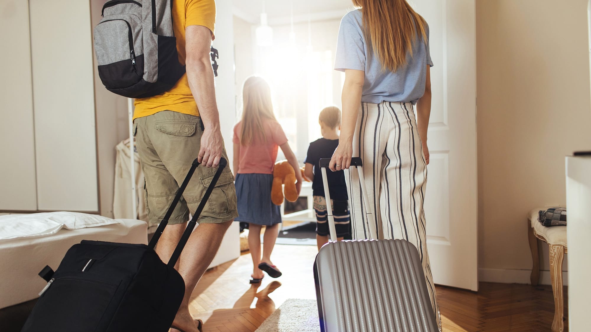 family with suitcases