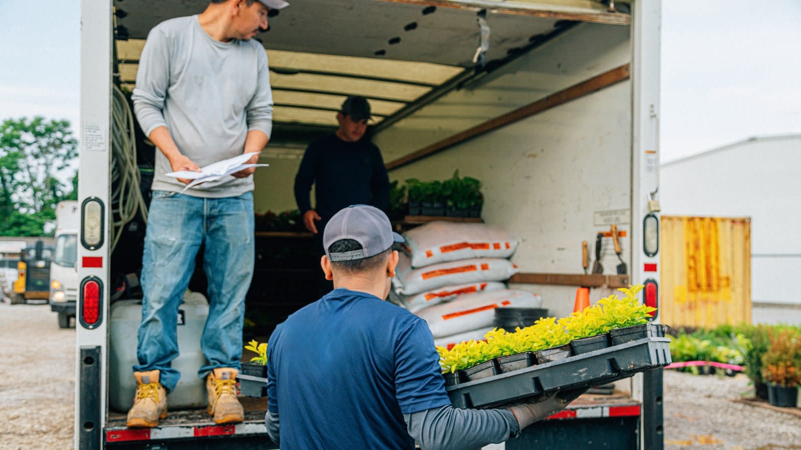 April 4 blog Team of landscapers unloading truck