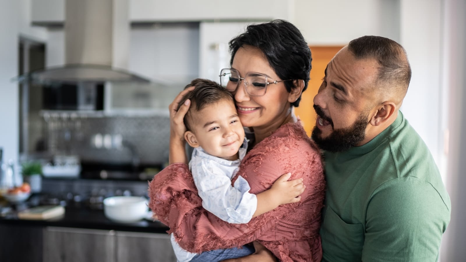 Using HSA Funds for Family Members mother and father looking at their baby