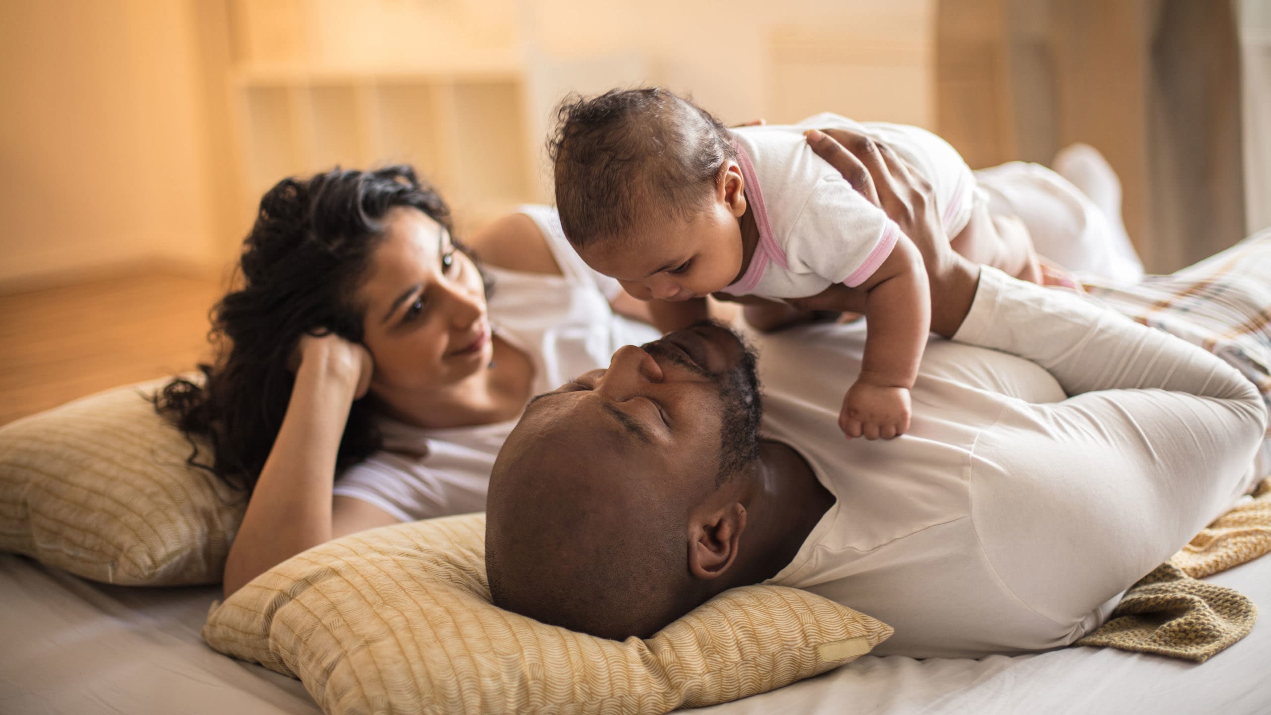 Parents spending time with their infant child.