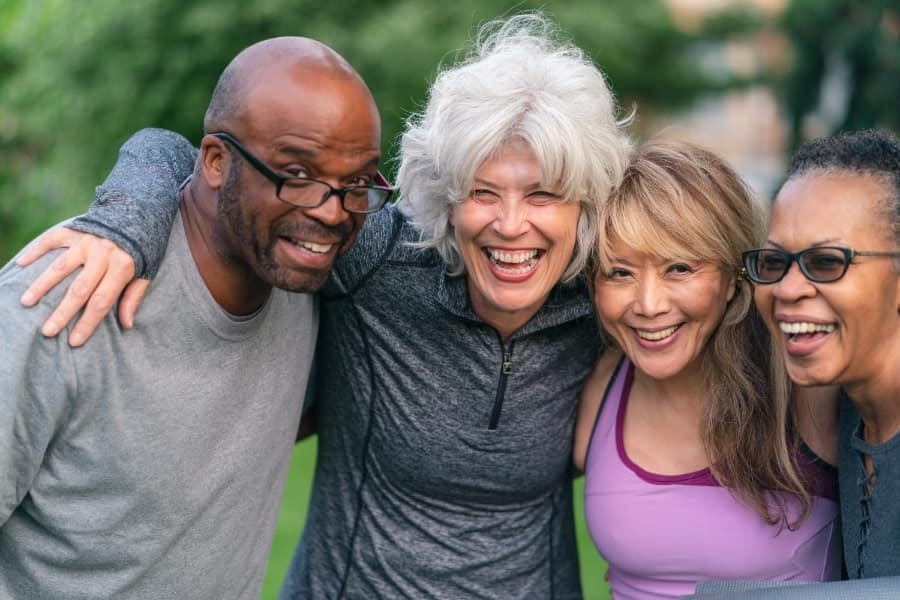 Portrait of multi-ethnic group of senior friends outdoors