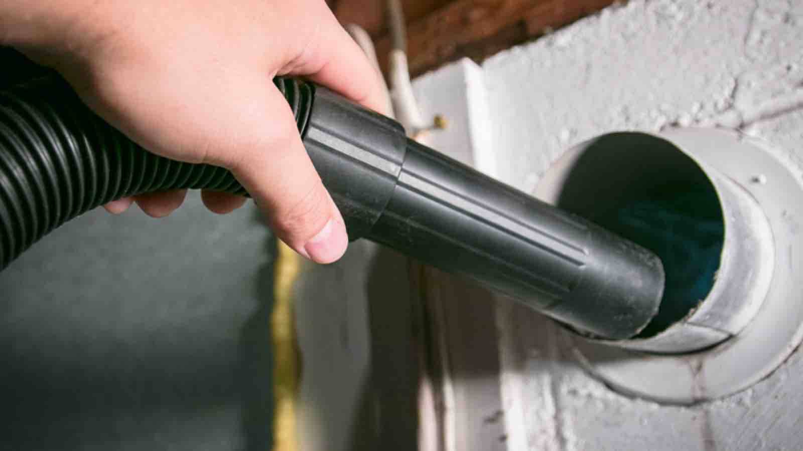 vacuuming out a dryer
