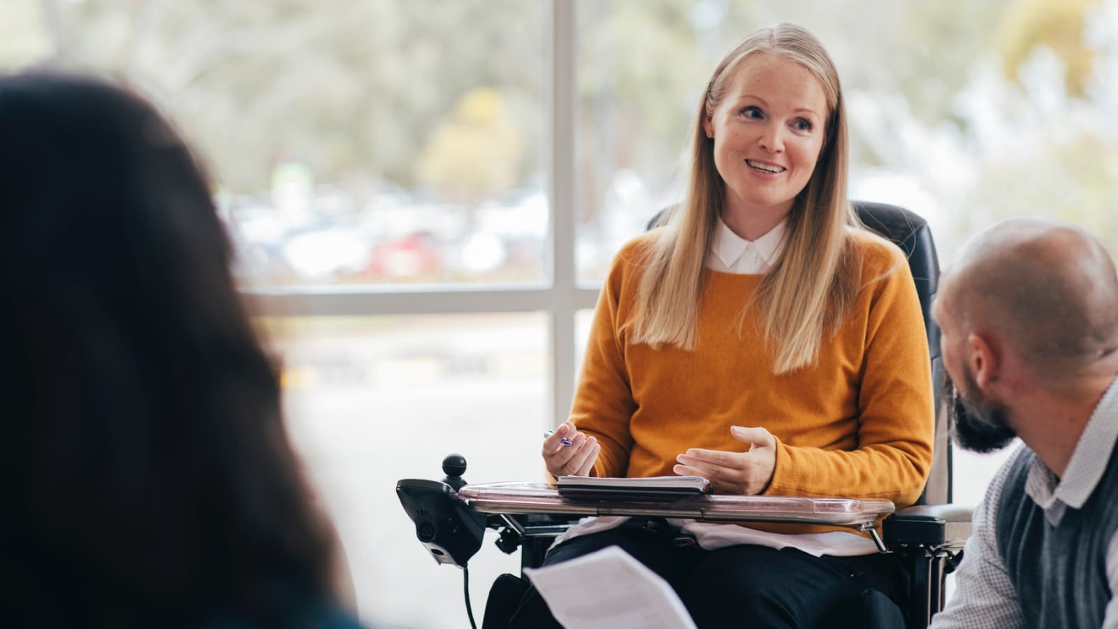 disability-inclusive workplace woman in wheelchair at work