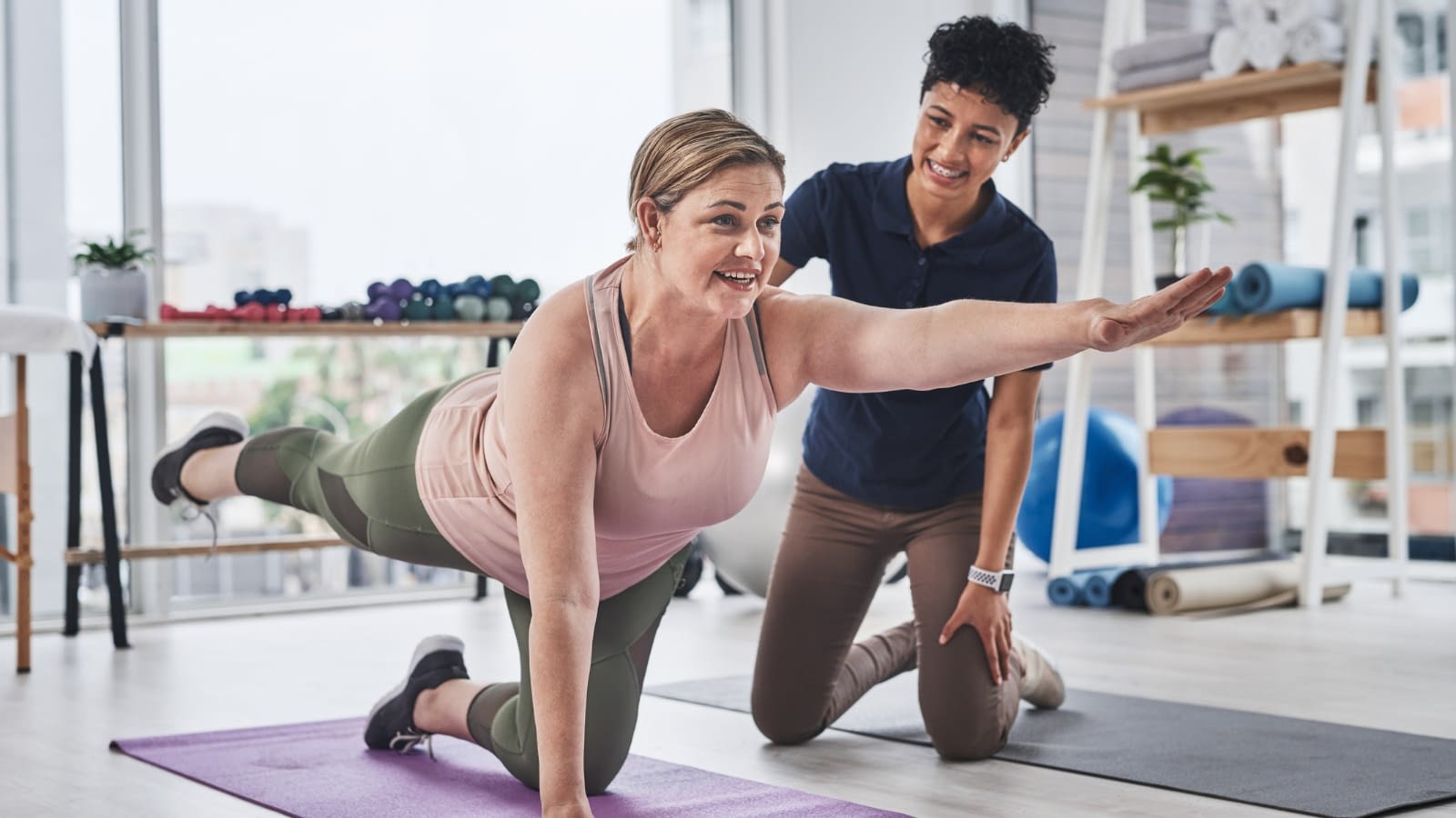 person stretching with trainer Happy person working out