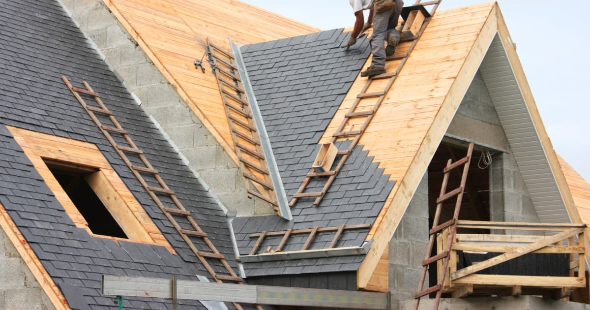 Coastal Contractors insurace Wilmington NC General Liability Insurance Roofer working on roof