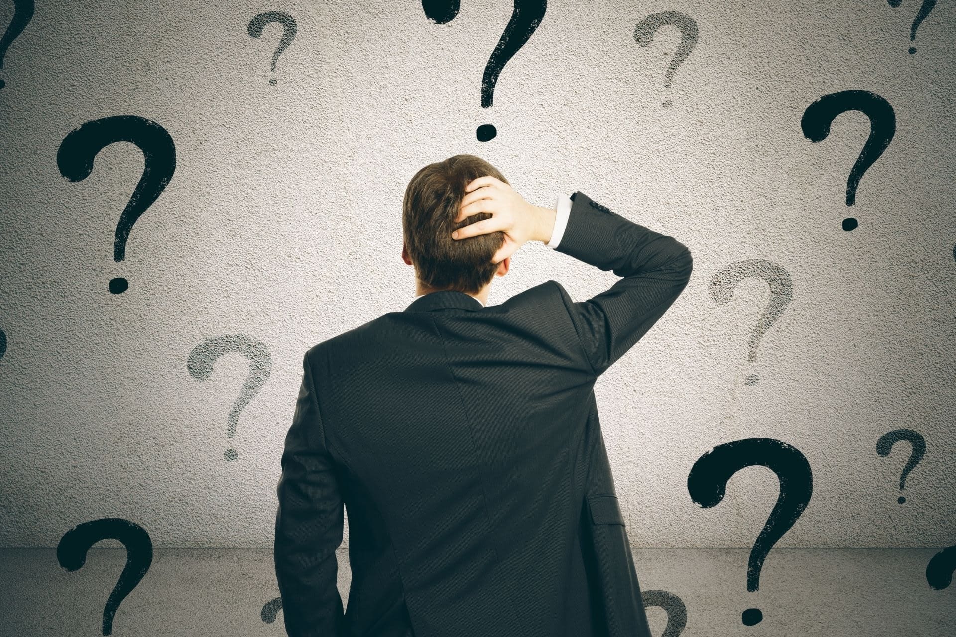 157 Confused person surrounded by questions marks