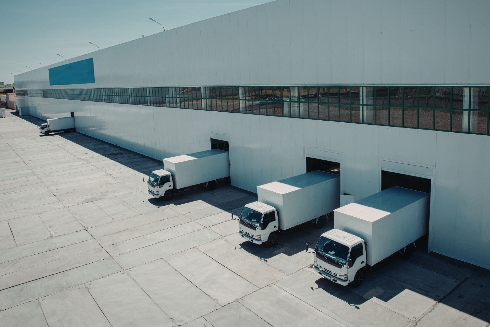 140 Commercial Trucks next to a building