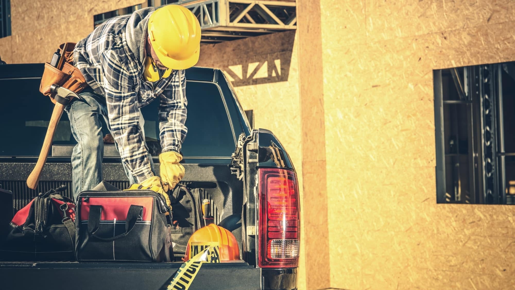 man on truck Contractor on bed of truck protected with Commercial Auto Insurance from Coastal Contractors Insurance in Wilmington, NC