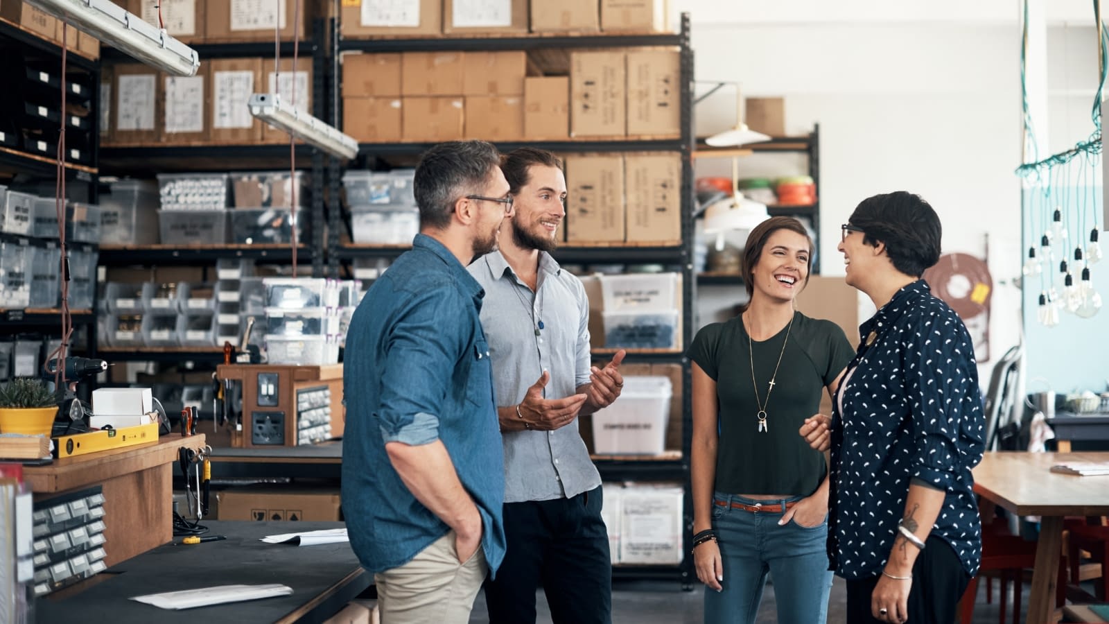 Feb 28 blog Employees at warehouse having discussion