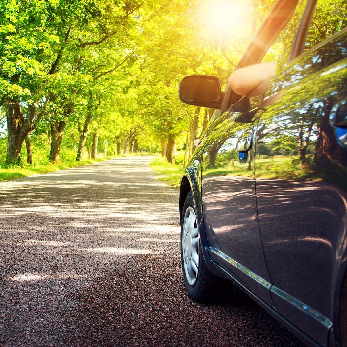 driving-car-on-road-with-window-down-and-elbow-out