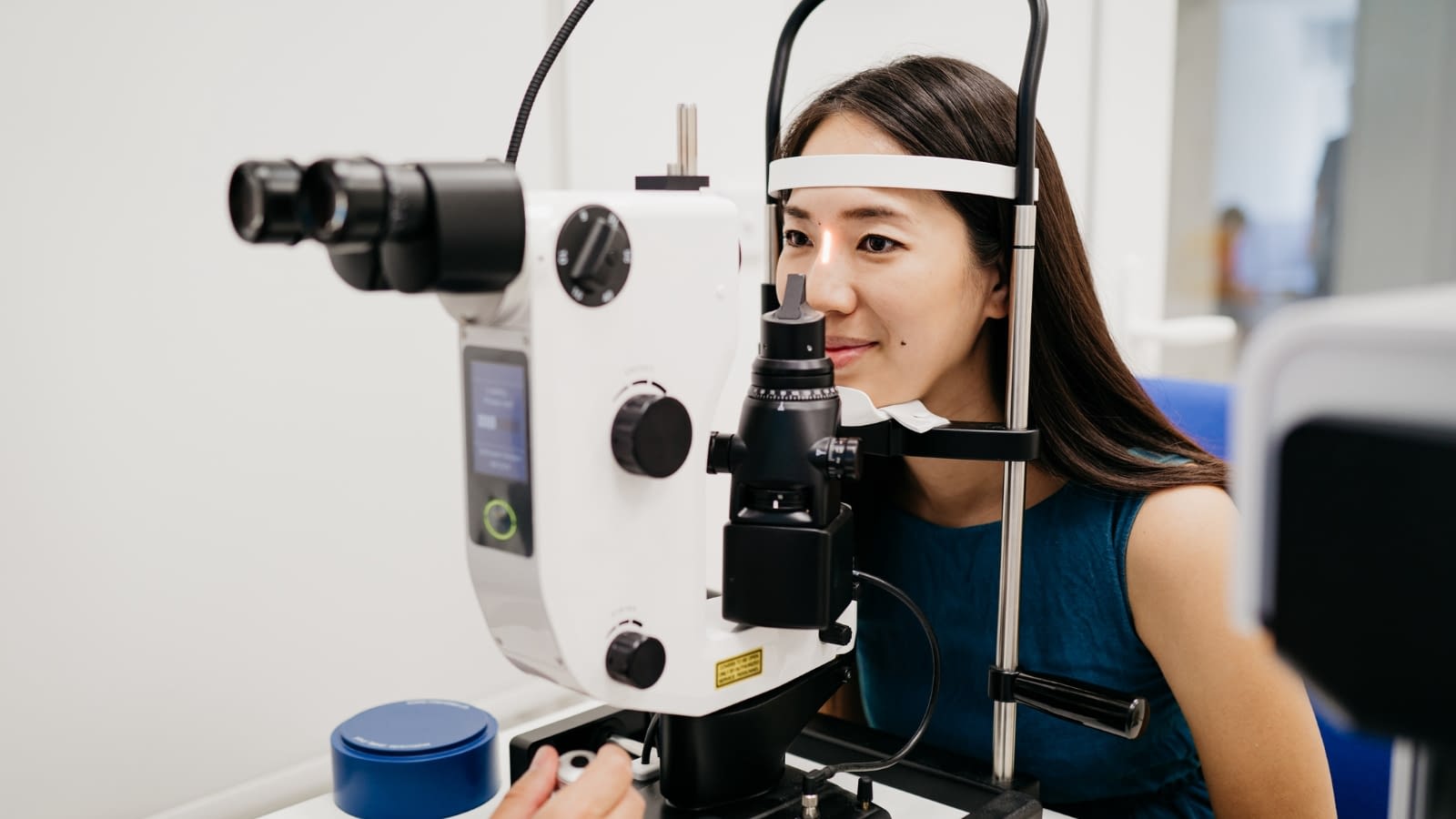 August 28 blog Young Asian woman at eye doctor appointment