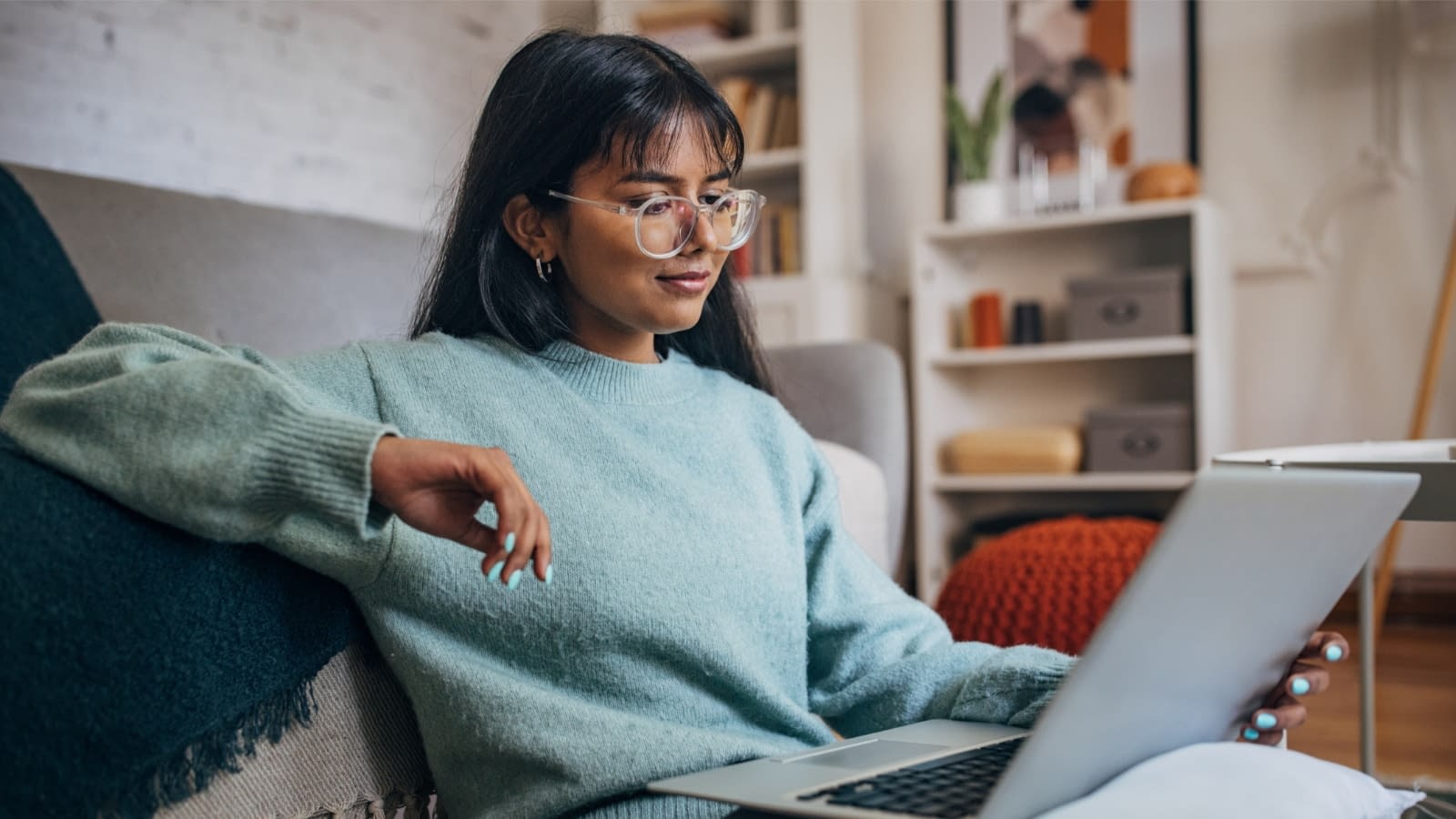 August 7 blog Young woman reading on laptop