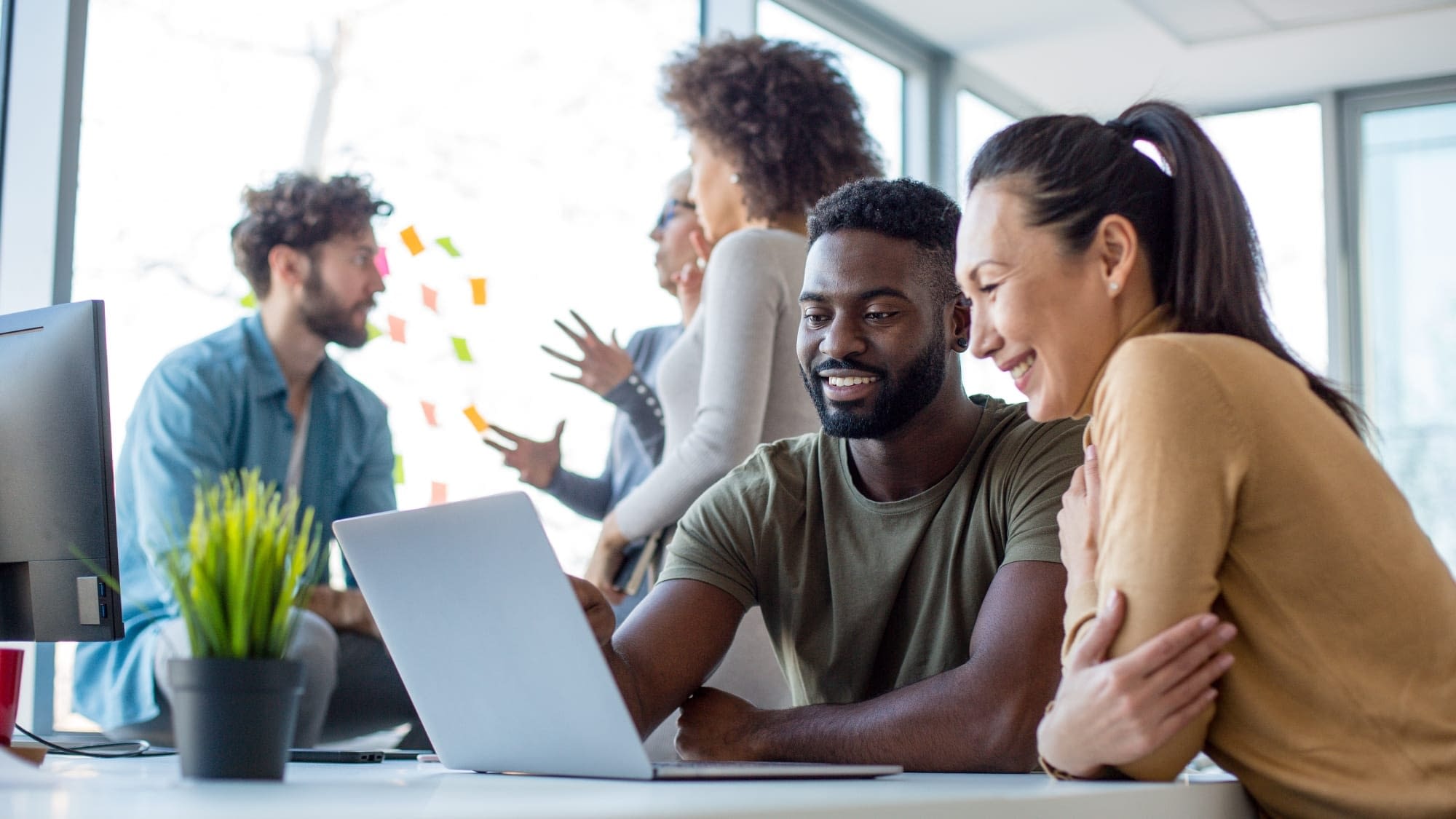 GettyImages-1209869264 (2) Coworkers in an office