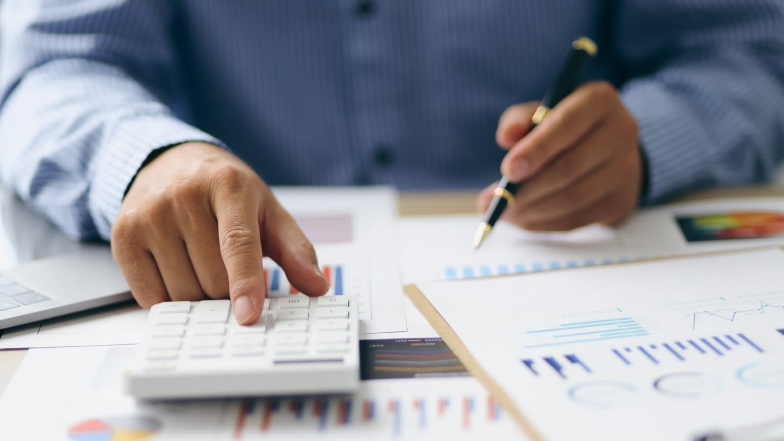 not having business insurance business person calculating finances