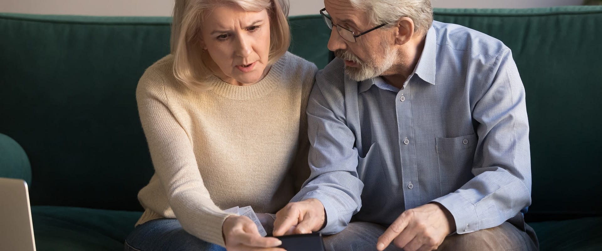 Confused Senior COuple Reviewing Paperwork