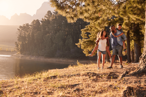 Summer Fun family hiking near a lake
