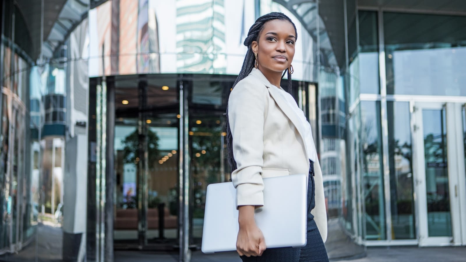 changing jobs businesswoman with a laptop in her hands