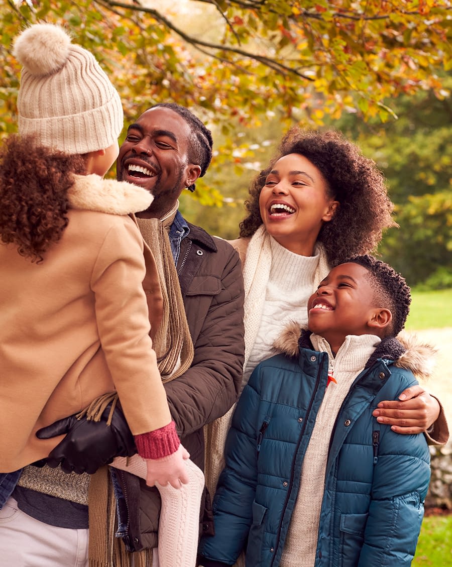 family Smiling family on walk through countryside