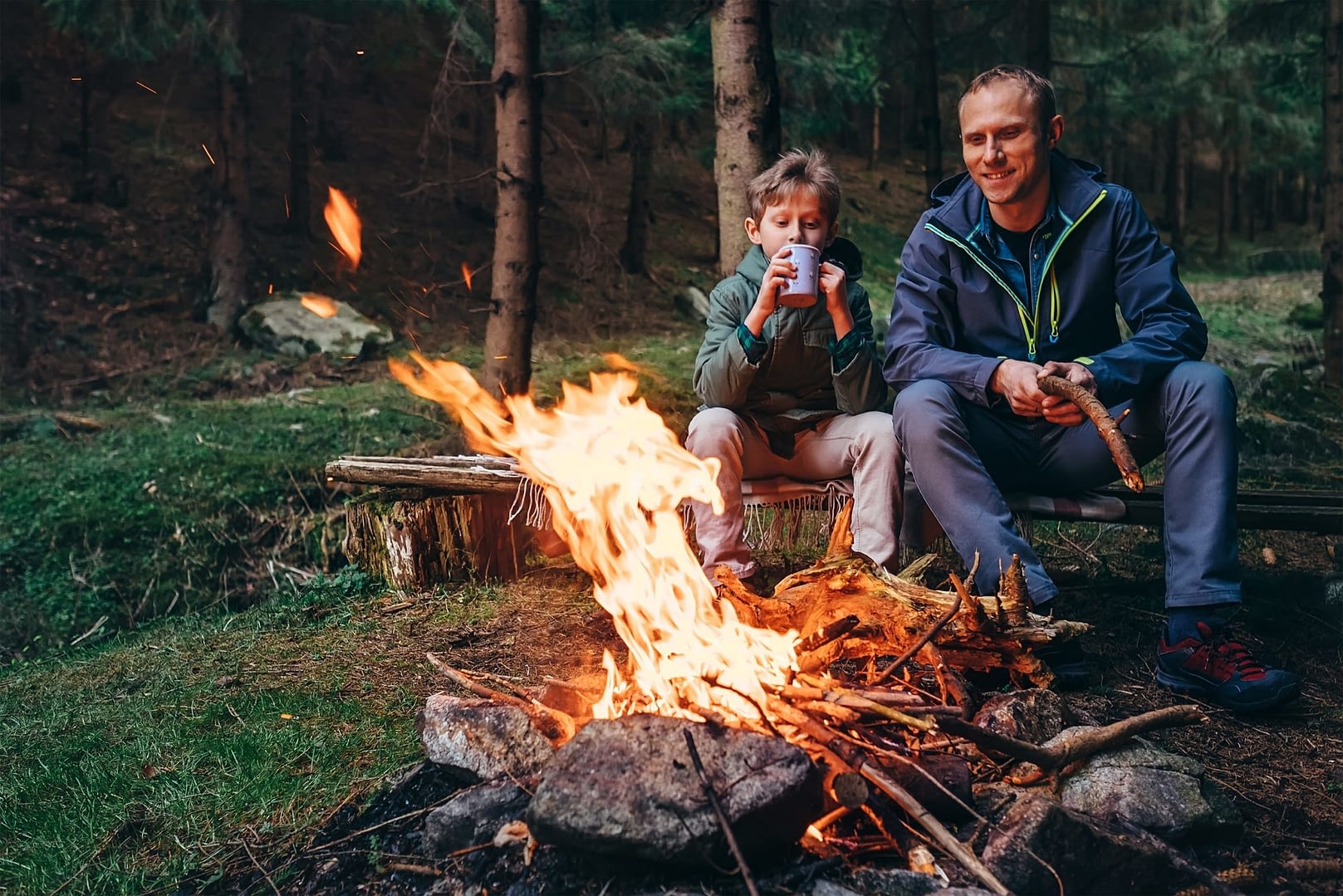 Father and Son Enjoying Campfire