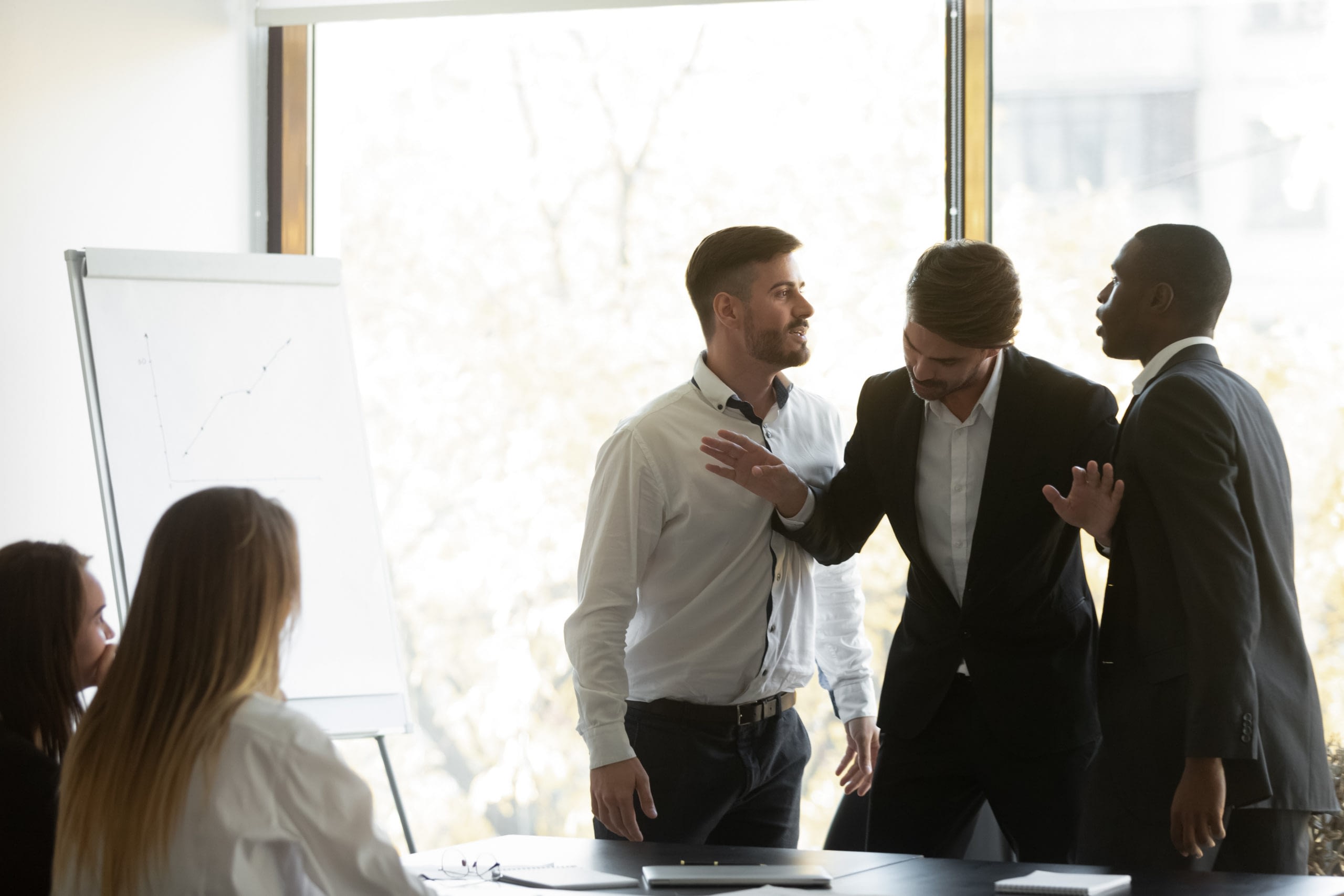 Millennial,Businessman,Setting,Apart,Two,Aggressive,Multiracial,Coworkers,,Starting,Fighting