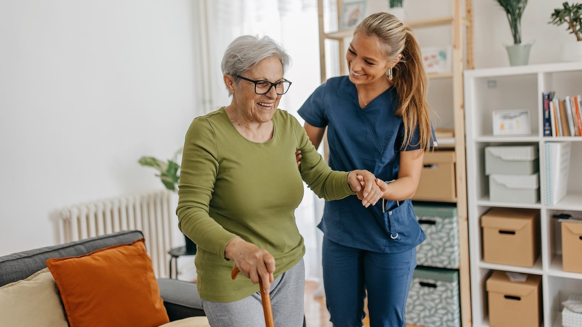 Nurse helping senior woman