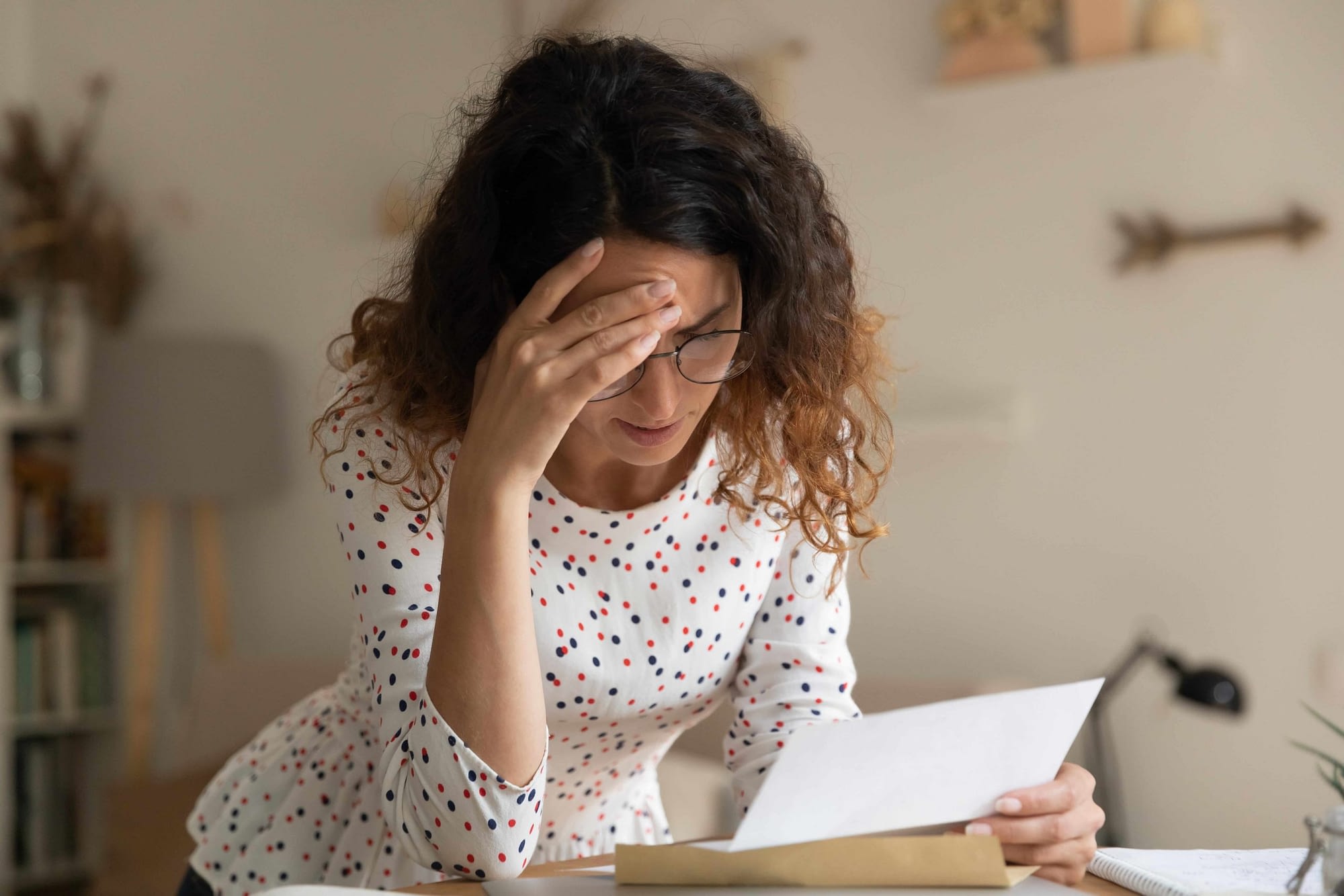 stressed woman reading paper