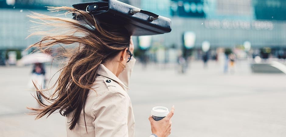 Woman Covering Head With Briefcase