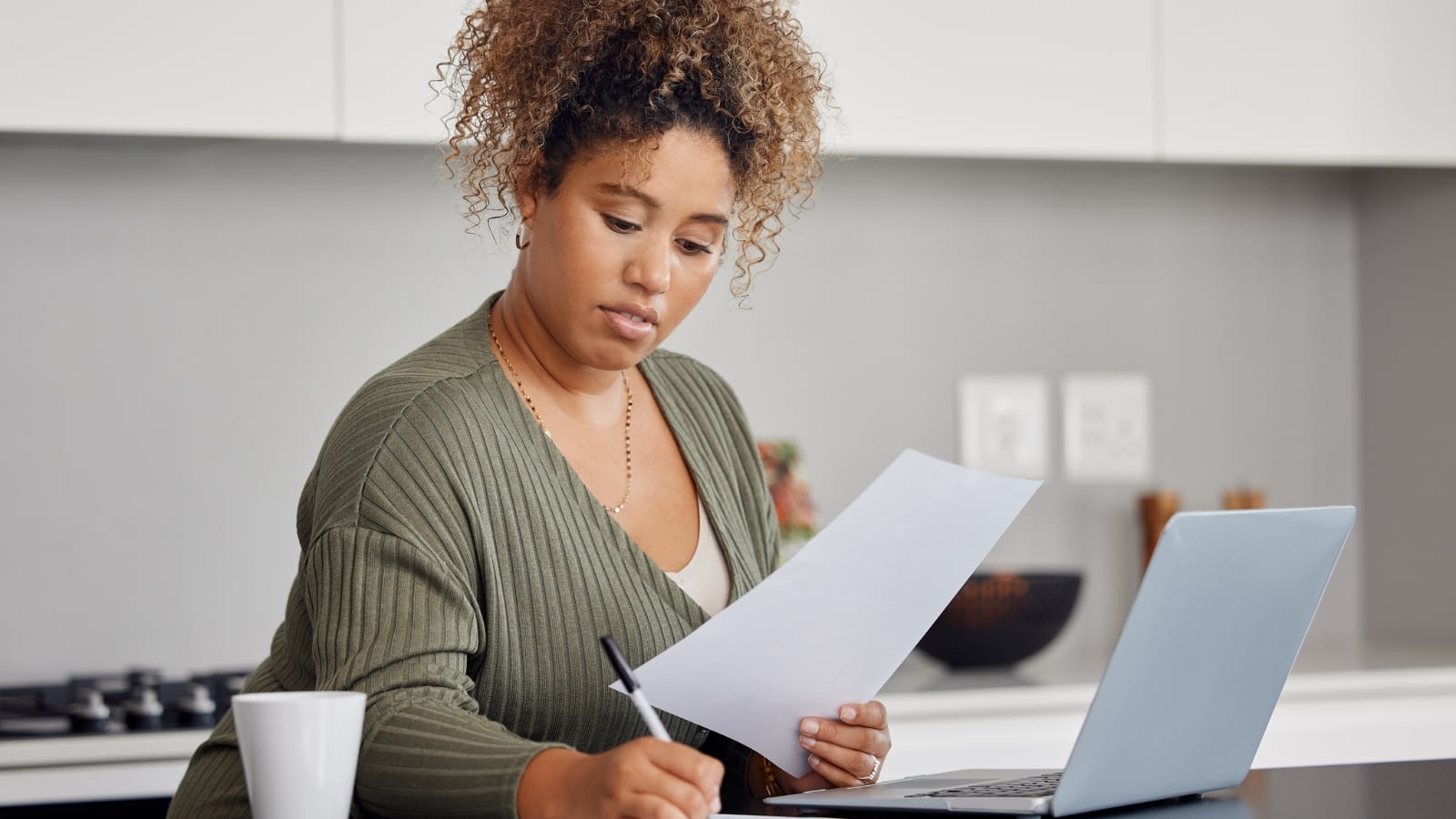 Woman looking through paperwork.