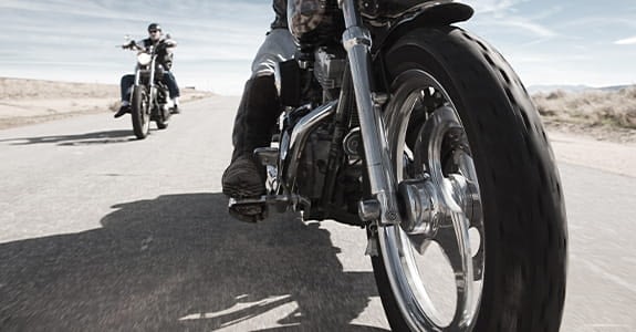 two_motorcycles_on_a_road__575x300