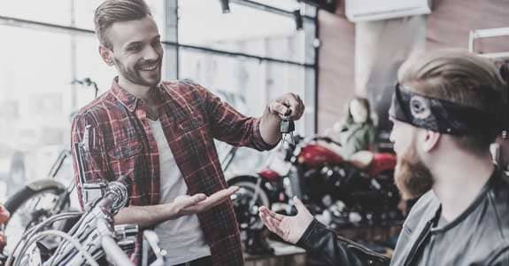 handing_motorcycle_keys_to_a_guy_575x300