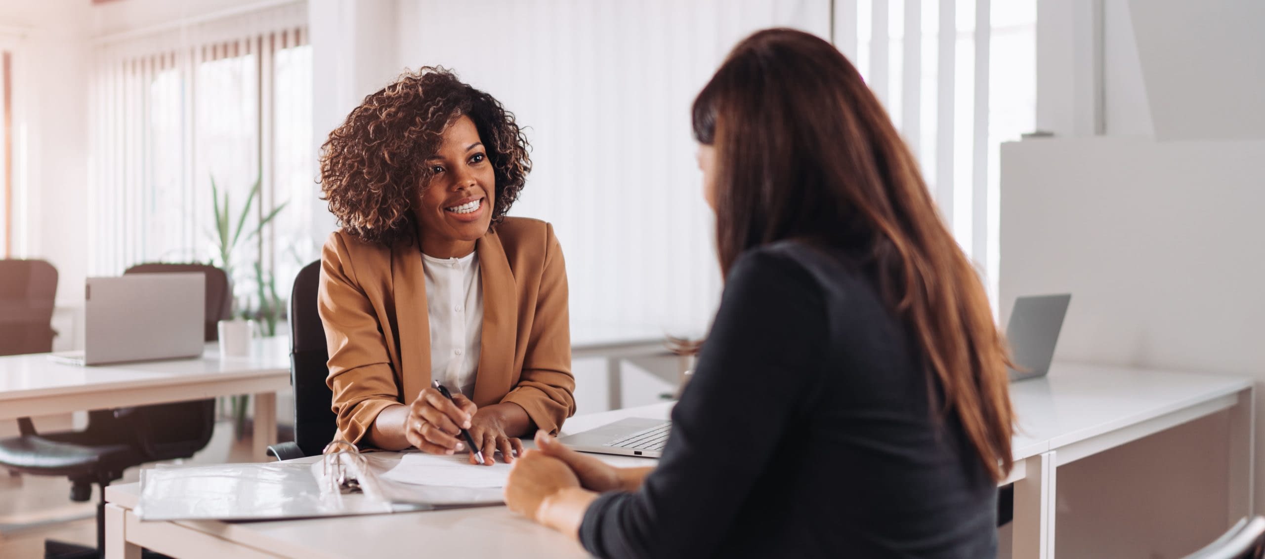 GettyImages-1260752753 Female Consultant Talking To Client