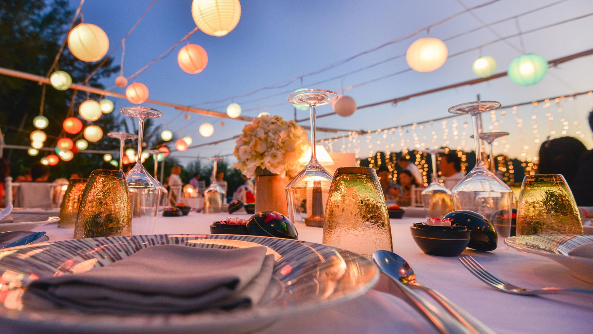 Close up of place setting for an outdoor wedding.