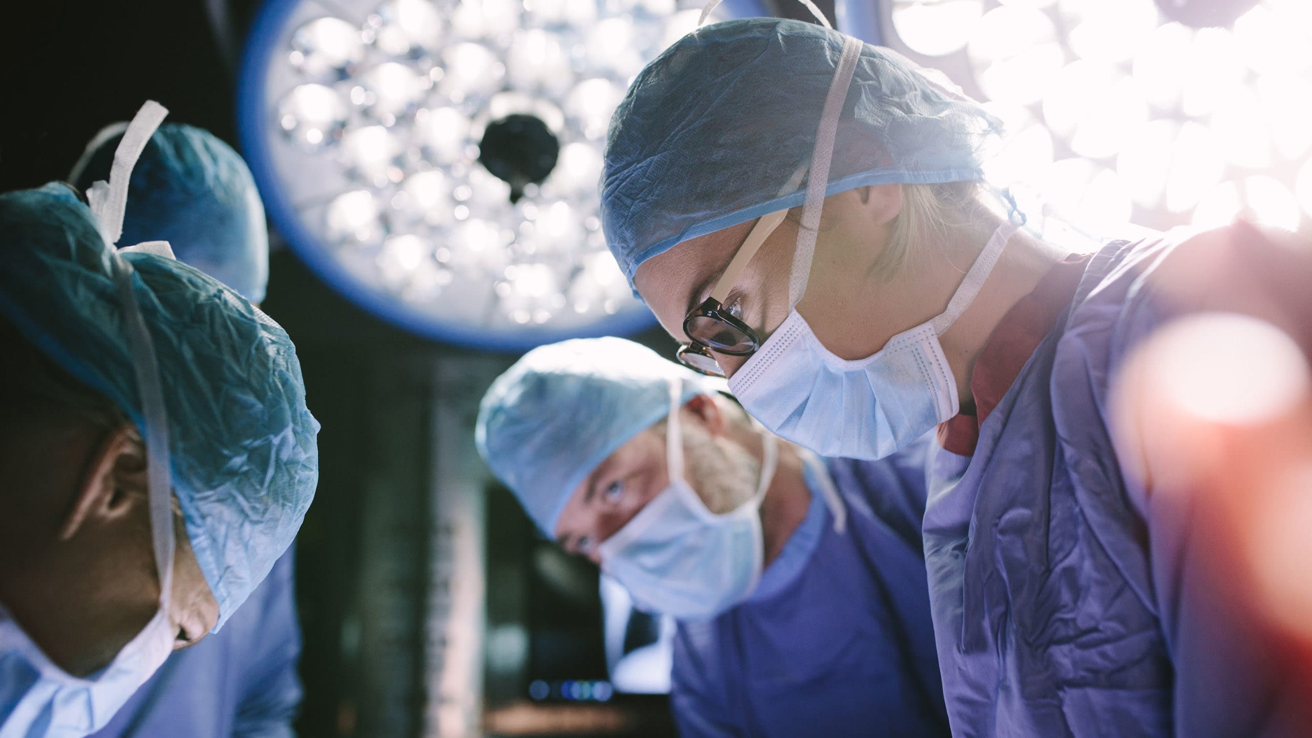 Surgeons during medical procedure.