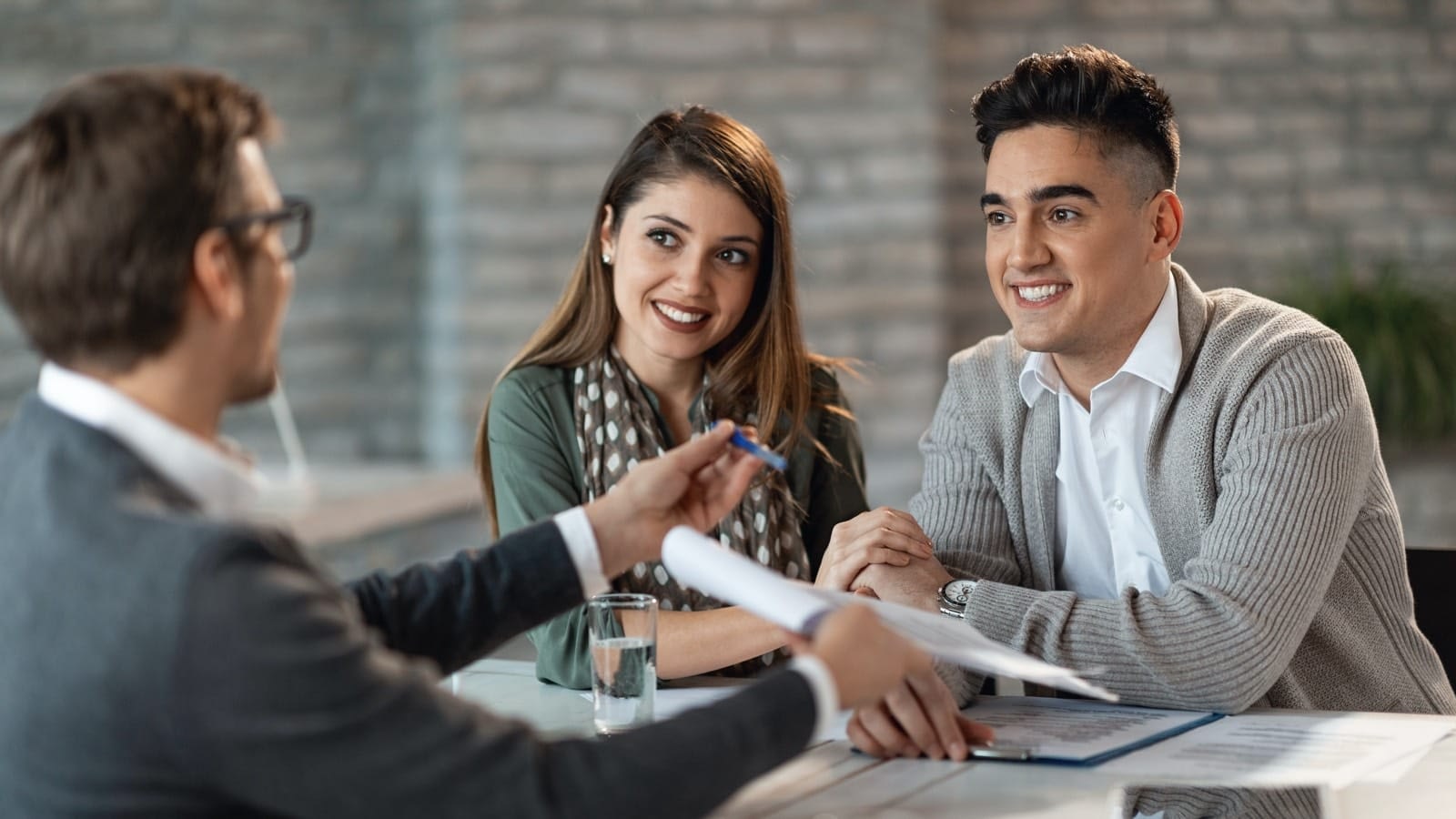 Young-Couple-Signing-Forms.jpg