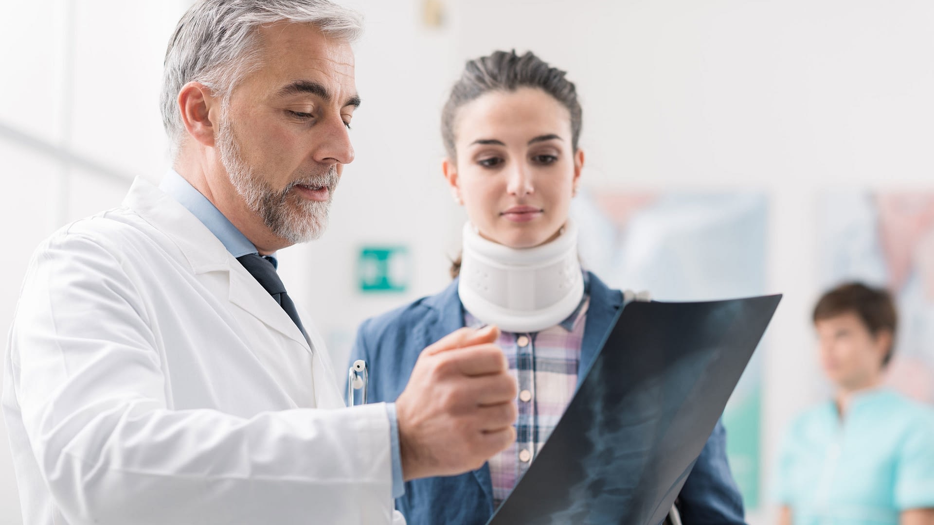 Doctor showing a young female patient her x-ray.