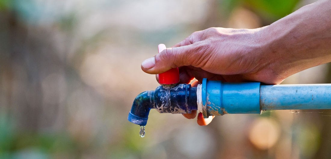 Hand Turning Off Hose