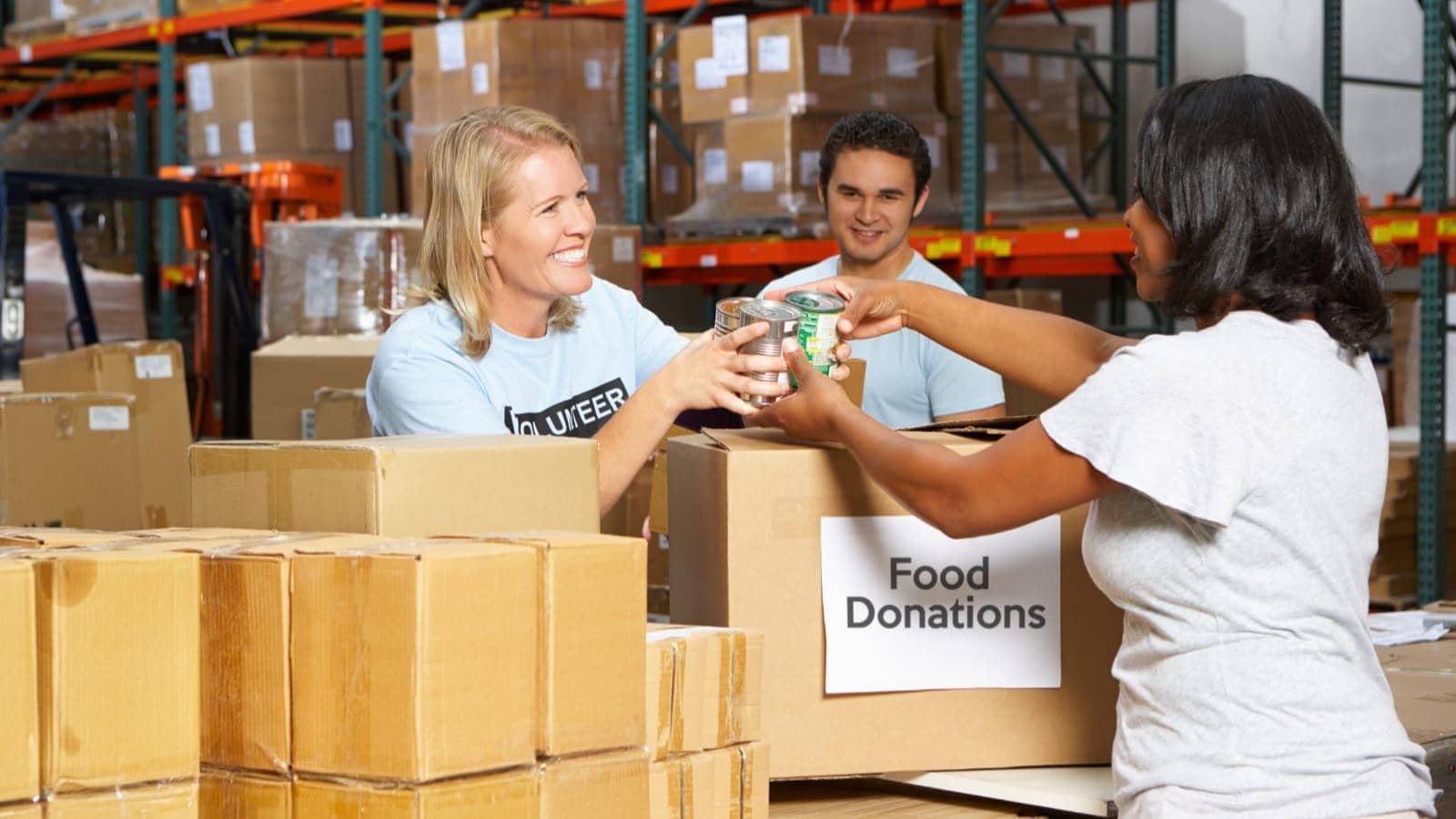 volunteers at a food donation warehosue