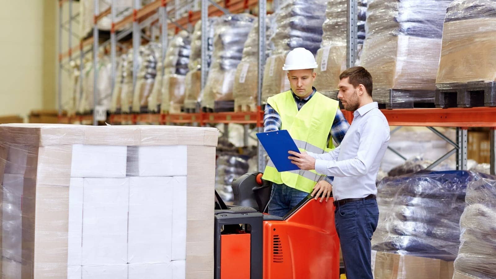 manager and worker at a packaging and shipping warehouse