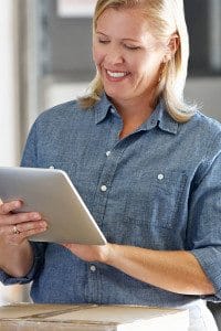 Female Business Owner Looking at iPad