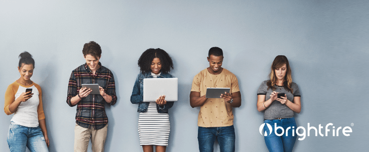 diverse group of people using devices