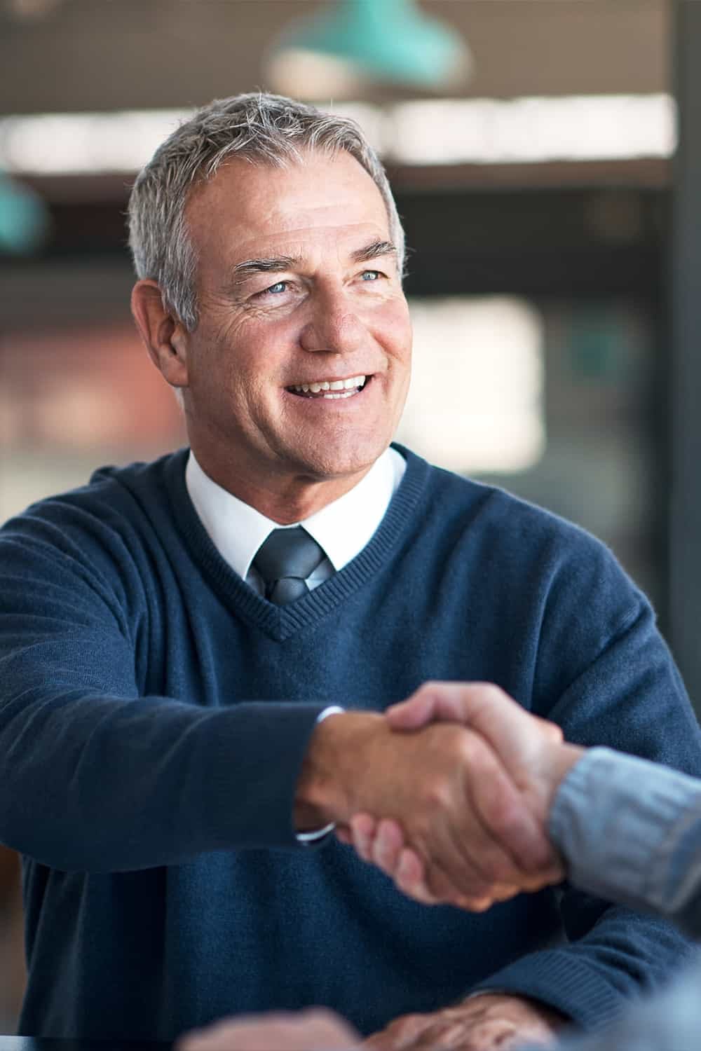 Guaranteed Retirement Income Plan – Preferred Insurance Person looking at retirement paperwork with text overlay "Retirement Is Not Guaranteed… Unless"