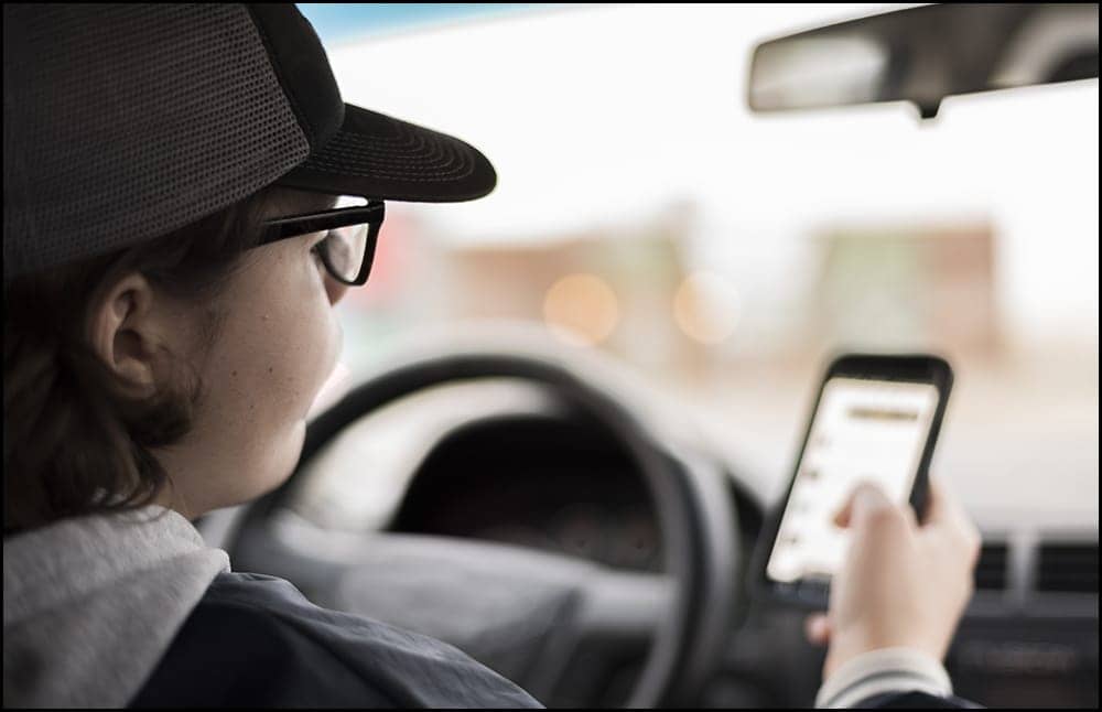 Teen-Driving-With-Phone-Dimmitt-Insurance